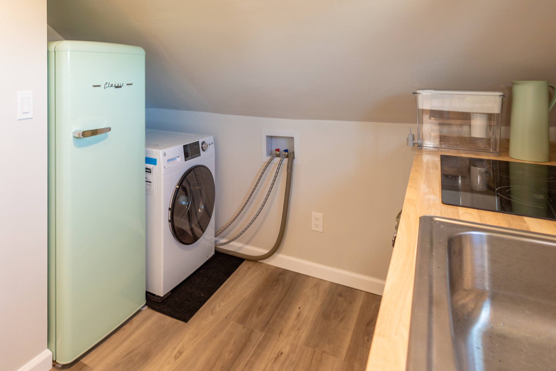 Kitchen showing GE 2.4 cubic foot combination washer and dryer