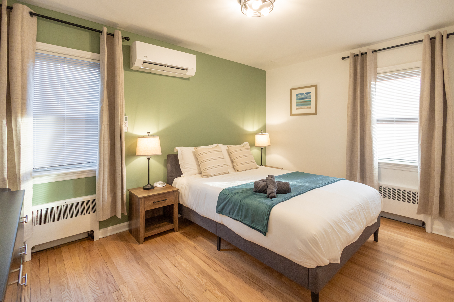 Sunlit bedroom with teal-accented