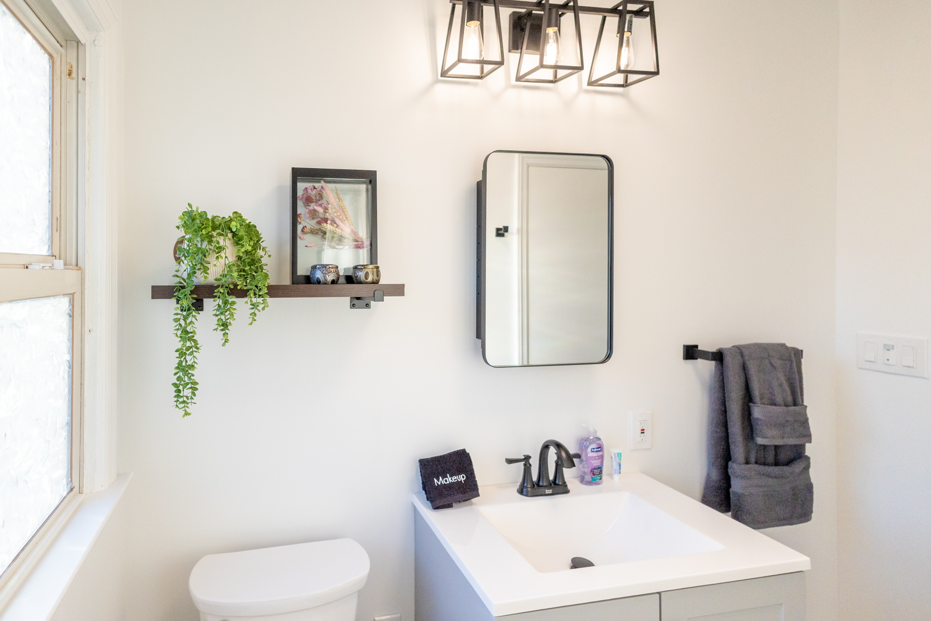 Modern bathroom sink with sleek mirror.